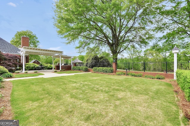 view of yard featuring a pergola, a patio, and fence