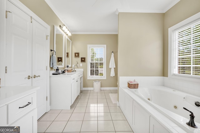 bathroom featuring a jetted tub, vanity, baseboards, tile patterned flooring, and crown molding