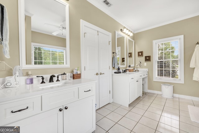 bathroom with two vanities, ornamental molding, visible vents, a healthy amount of sunlight, and a sink