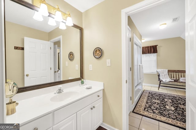 bathroom featuring vanity, baseboards, tile patterned flooring, and visible vents