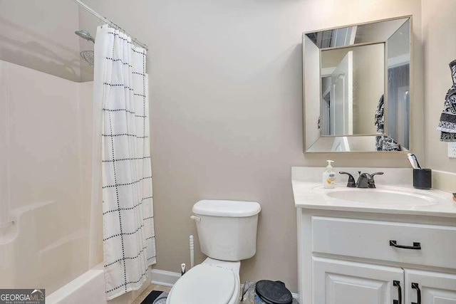145 Spring Lake Cir, Brunswick, GA 31525 - full bath featuring shower / bath combo, vanity, baseboards, and toilet