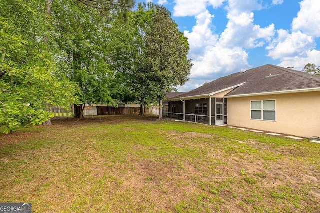 145 Spring Lake Cir, Brunswick, GA 31525 - view of yard with fence and a sunroom