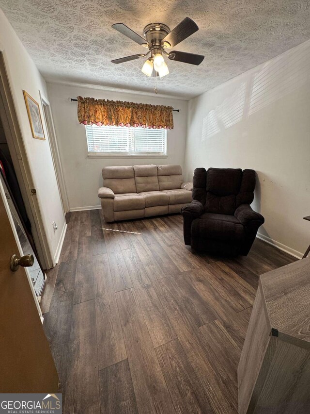 6695 Cedar Hurst Trl, Atlanta, GA 30349 - living area with baseboards, ceiling fan, and hardwood / wood-style floors