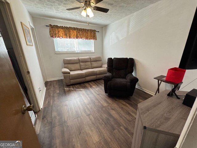 6695 Cedar Hurst Trl, Atlanta, GA 30349 - living area with hardwood / wood-style flooring, baseboards, and ceiling fan