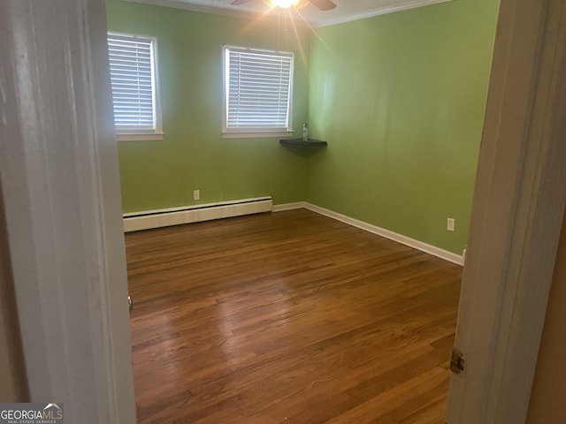 826 Nelson St, Jackson, GA 30233 - spare room featuring baseboards, a baseboard heating unit, ornamental molding, and wood finished floors
