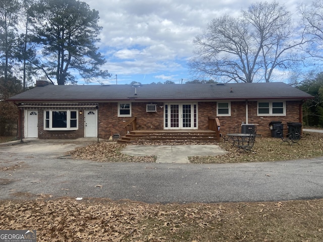 826 Nelson St, Jackson, GA 30233 - single story home featuring brick siding, french doors, central air condition unit, and a wall unit AC