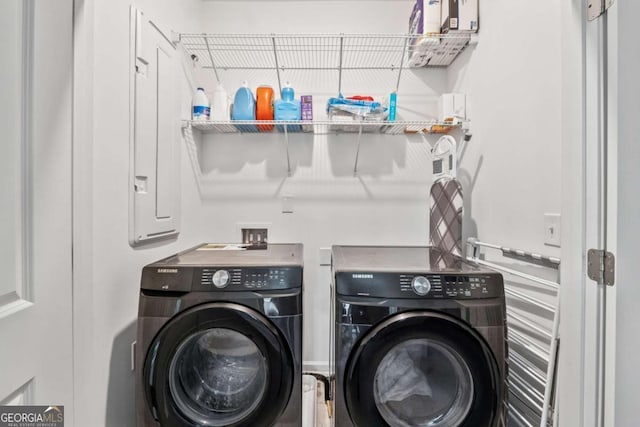 washroom featuring washing machine and clothes dryer and laundry area