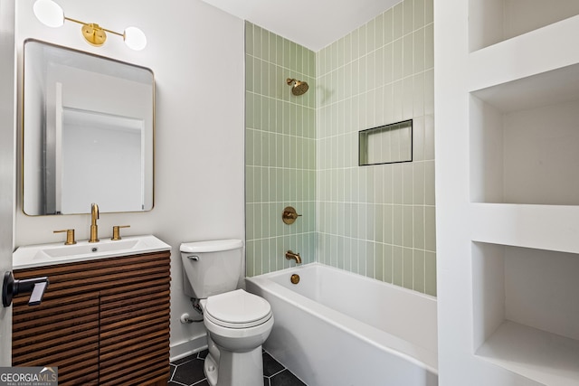 bathroom featuring toilet, vanity, tile patterned floors, and shower / tub combination