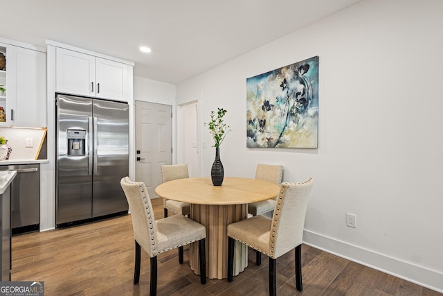 dining area featuring baseboards, recessed lighting, and light wood-style floors