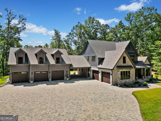 1472 Grizzle Rd, Dawsonville, GA 30534 - view of front of home featuring board and batten siding, decorative driveway, and a garage