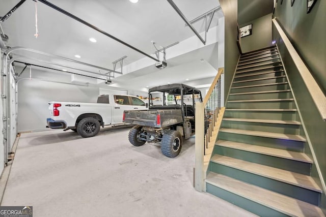 garage featuring recessed lighting and a garage door opener