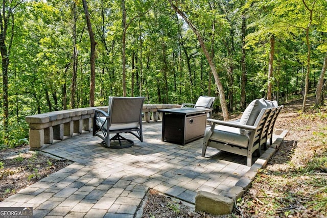 view of patio / terrace with a wooded view