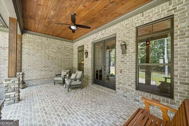 view of patio with ceiling fan and french doors