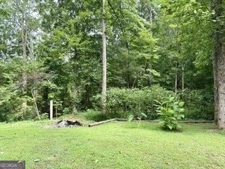 view of landscape featuring a wooded view