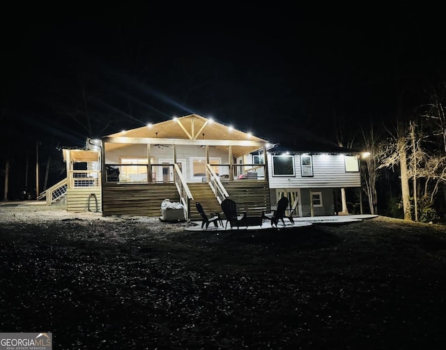 back of house at night featuring stairs