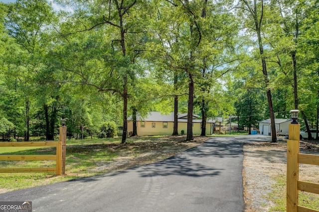 view of street with aphalt driveway