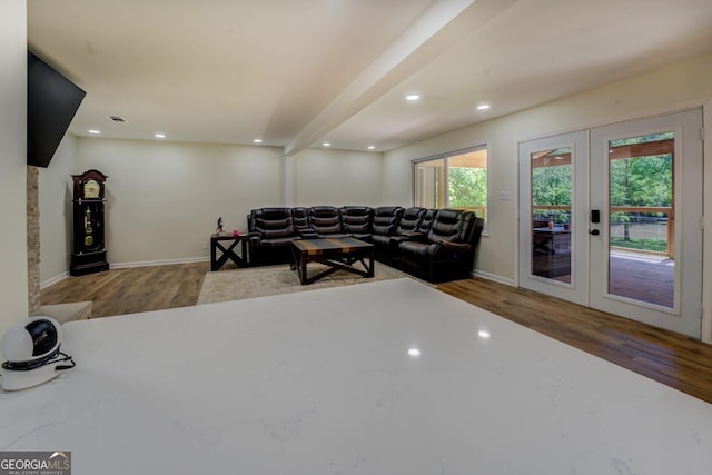 living room with baseboards, french doors, and wood finished floors