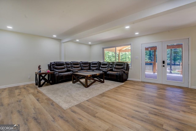 living area with baseboards, french doors, recessed lighting, and wood finished floors