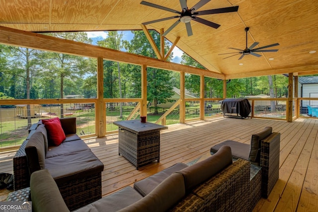 sunroom featuring plenty of natural light and ceiling fan