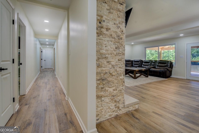corridor with recessed lighting, baseboards, and wood finished floors