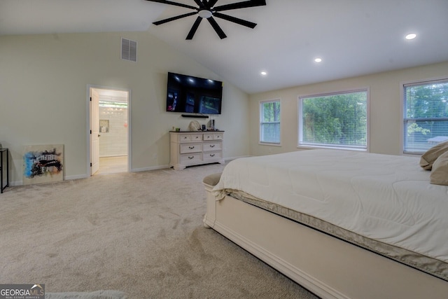 bedroom with visible vents, carpet, vaulted ceiling, and multiple windows
