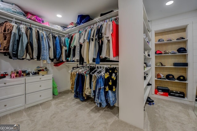 walk in closet featuring carpet