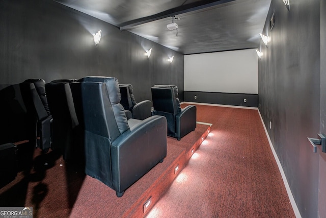 carpeted cinema featuring baseboards