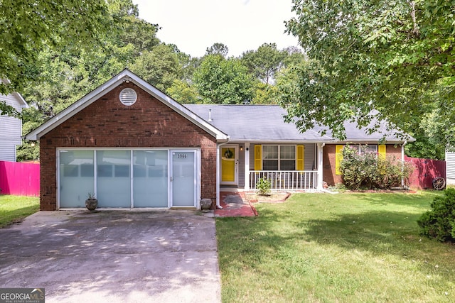 ranch-style home with an attached garage, a front lawn, brick siding, a porch, and driveway