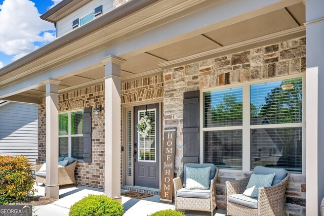 view of exterior entry featuring a porch