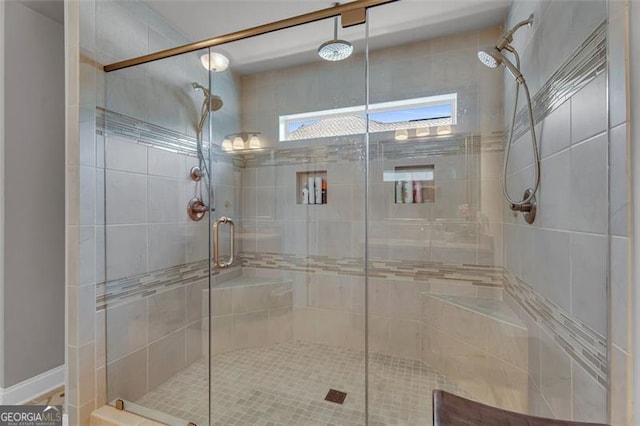 full bath featuring a shower stall