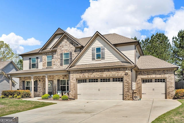 craftsman inspired home with concrete driveway, brick siding, and a shingled roof