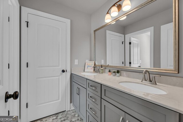 bathroom featuring double vanity and a sink