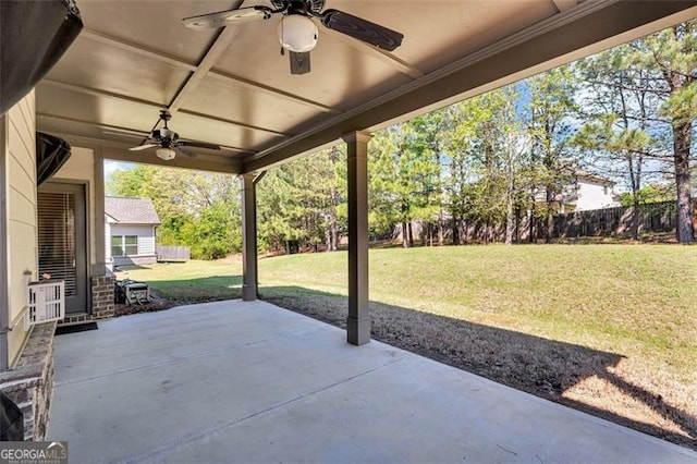 view of patio / terrace featuring fence and a ceiling fan