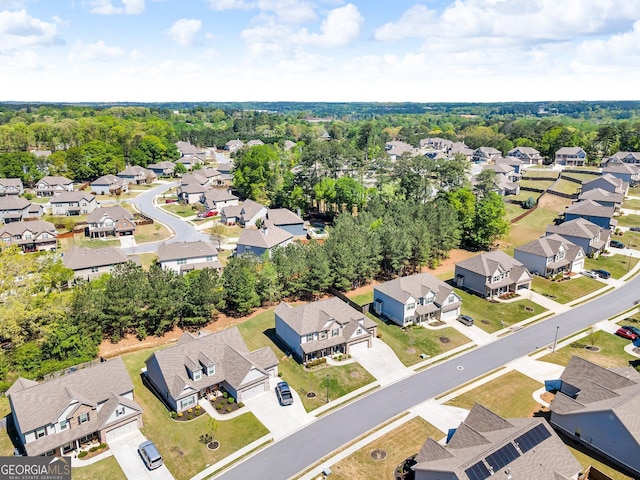 birds eye view of property with a residential view