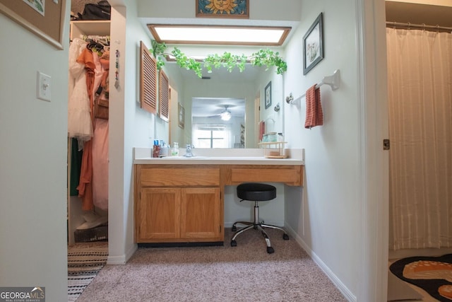 bathroom with baseboards, vanity, and a shower with curtain