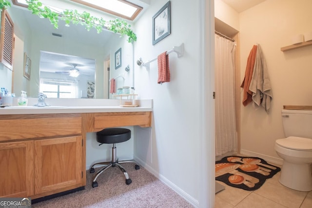 full bathroom with toilet, vanity, a shower with curtain, and baseboards