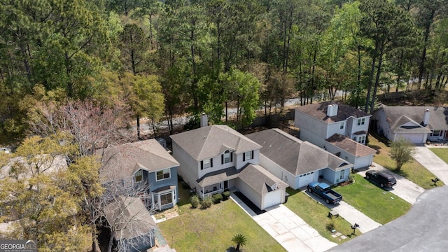 aerial view featuring a residential view and a view of trees
