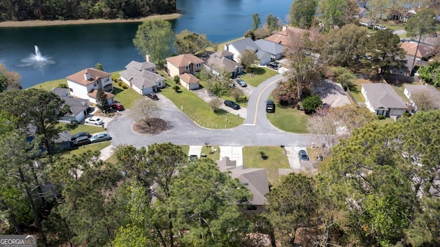 bird's eye view with a water view and a residential view