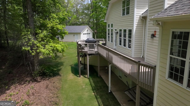 150 Fauna Meadows Dr, Newnan, GA 30263 - deck with a yard, an outbuilding, and view of wooded area