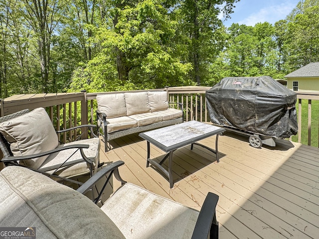 150 Fauna Meadows Dr, Newnan, GA 30263 - wooden deck with an outdoor hangout area, a grill, and view of wooded area