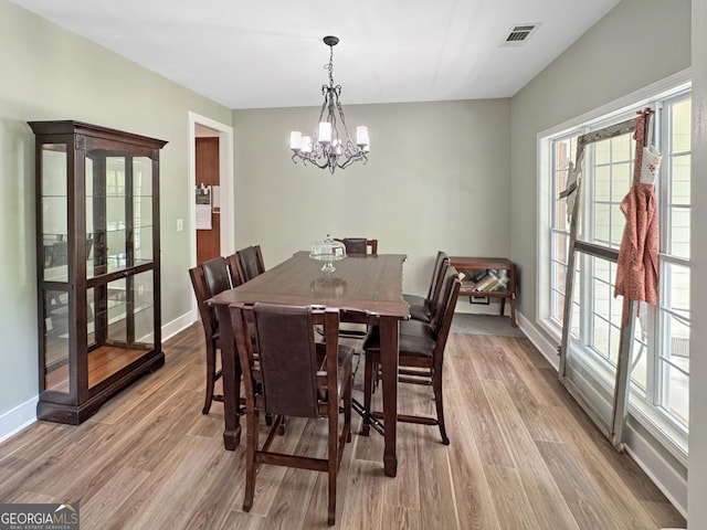 150 Fauna Meadows Dr, Newnan, GA 30263 - dining area featuring a chandelier and light wood-style floors