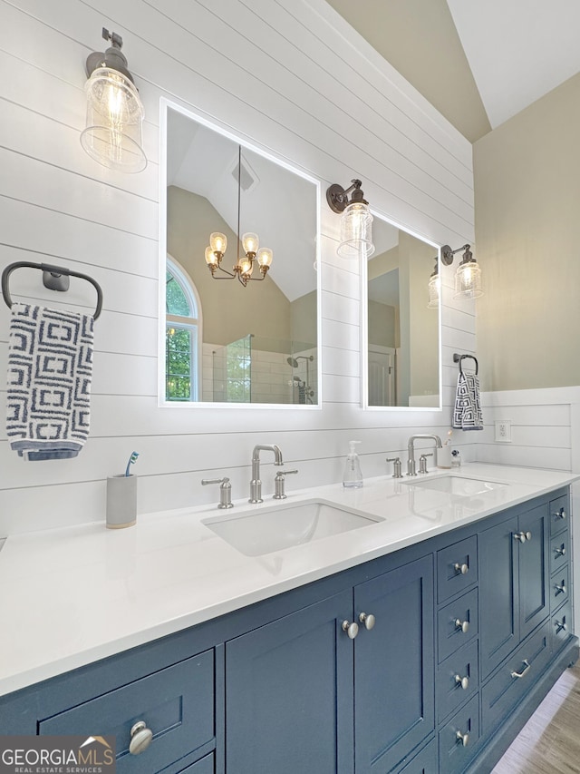 150 Fauna Meadows Dr, Newnan, GA 30263 - full bath with lofted ceiling, double vanity, a chandelier, a tile shower, and wood finished floors