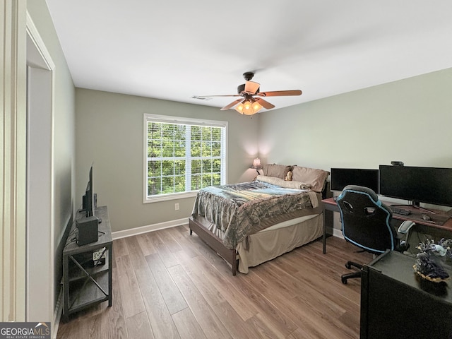 150 Fauna Meadows Dr, Newnan, GA 30263 - bedroom with a desk, wood finished floors, and ceiling fan