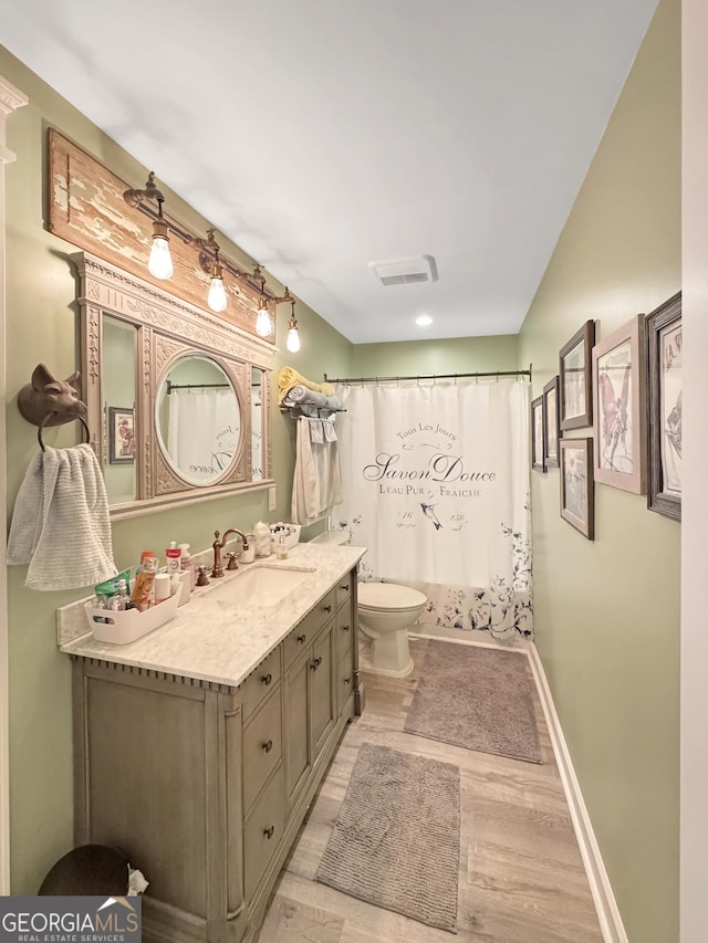 150 Fauna Meadows Dr, Newnan, GA 30263 - bathroom with wood finished floors, vanity, and curtained shower