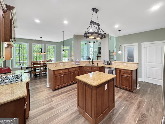 150 Fauna Meadows Dr, Newnan, GA 30263 - kitchen with a spacious island, appliances with stainless steel finishes, light wood-type flooring, decorative light fixtures, and recessed lighting