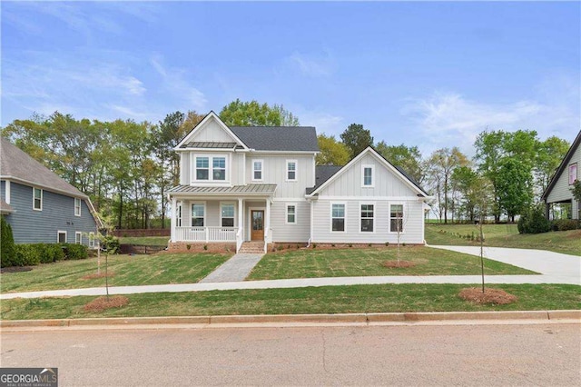 4038 Andover Cir, Mcdonough, GA 30252 - view of front of property featuring a front yard, a porch, and board and batten siding
