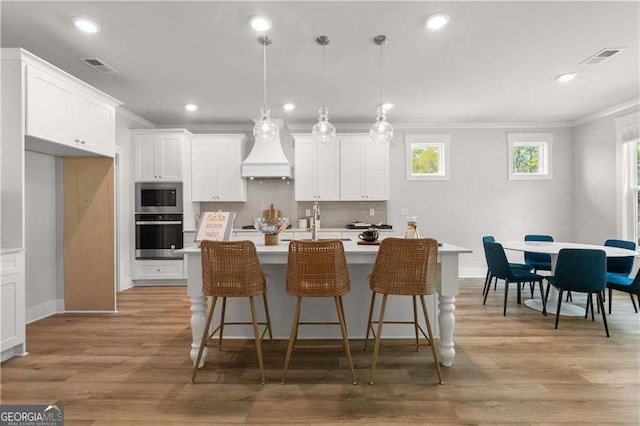 4038 Andover Cir, Mcdonough, GA 30252 - kitchen with ornamental molding, visible vents, light countertops, and recessed lighting