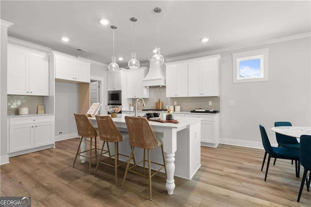 4038 Andover Cir, Mcdonough, GA 30252 - kitchen with custom exhaust hood, decorative backsplash, recessed lighting, and crown molding