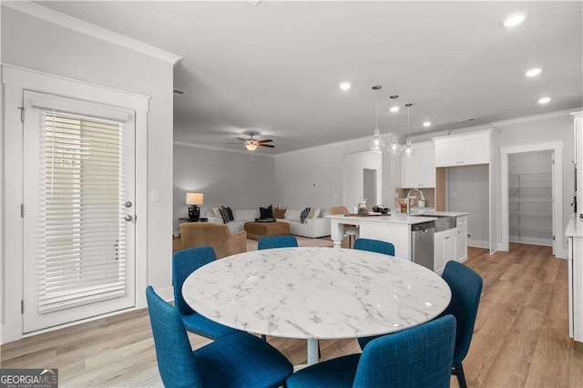 4038 Andover Cir, Mcdonough, GA 30252 - dining space with ornamental molding, ceiling fan, recessed lighting, and light wood finished floors