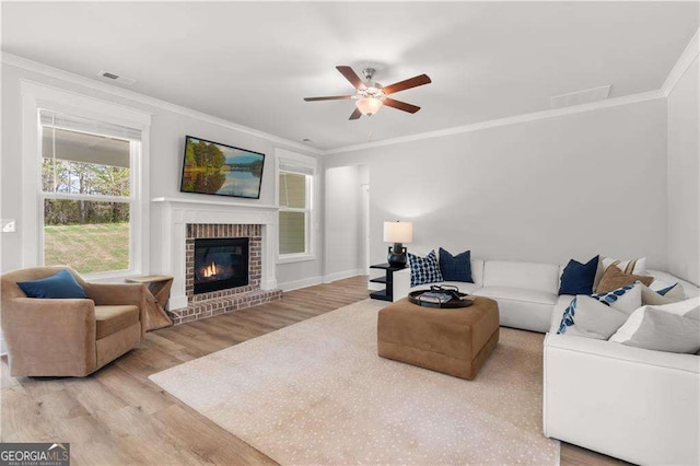 4038 Andover Cir, Mcdonough, GA 30252 - living room with visible vents, light wood-type flooring, and crown molding